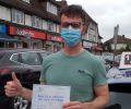 Bryan with Driving test pass certificate